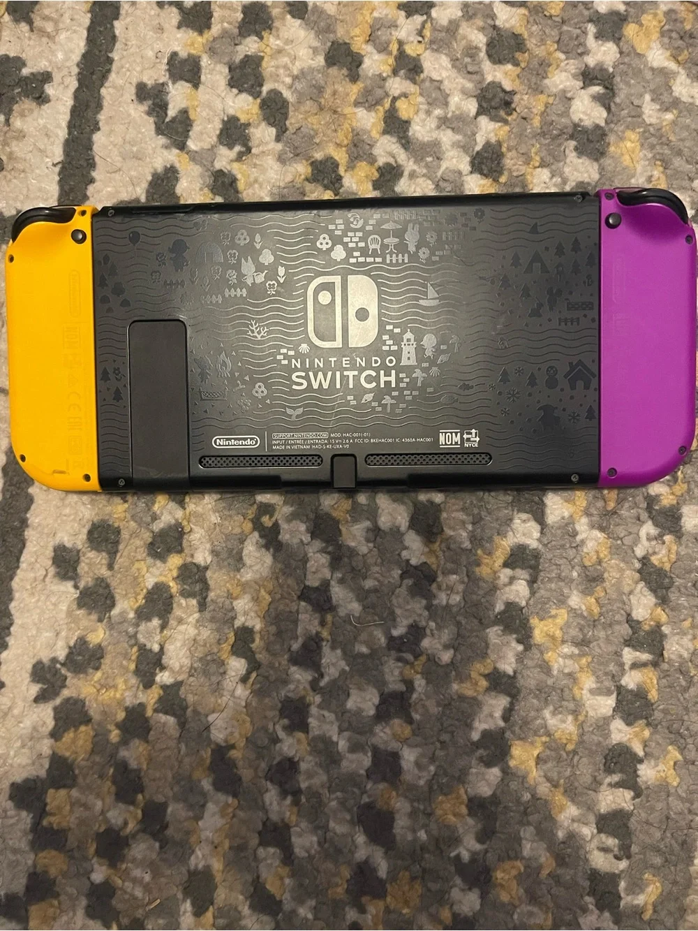 Nintendo Switch with Yellow Left Joy‑Con and Mint Right Joy‑Con
